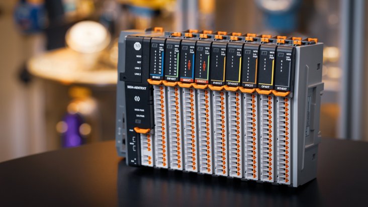 Left-facing view of PointMax I/O system (XT variant) on a table in a manufacturing environment
