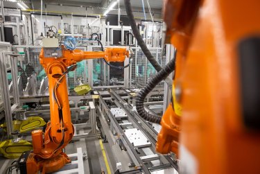 Automatic robots in the industrial factory for assembly automotive products