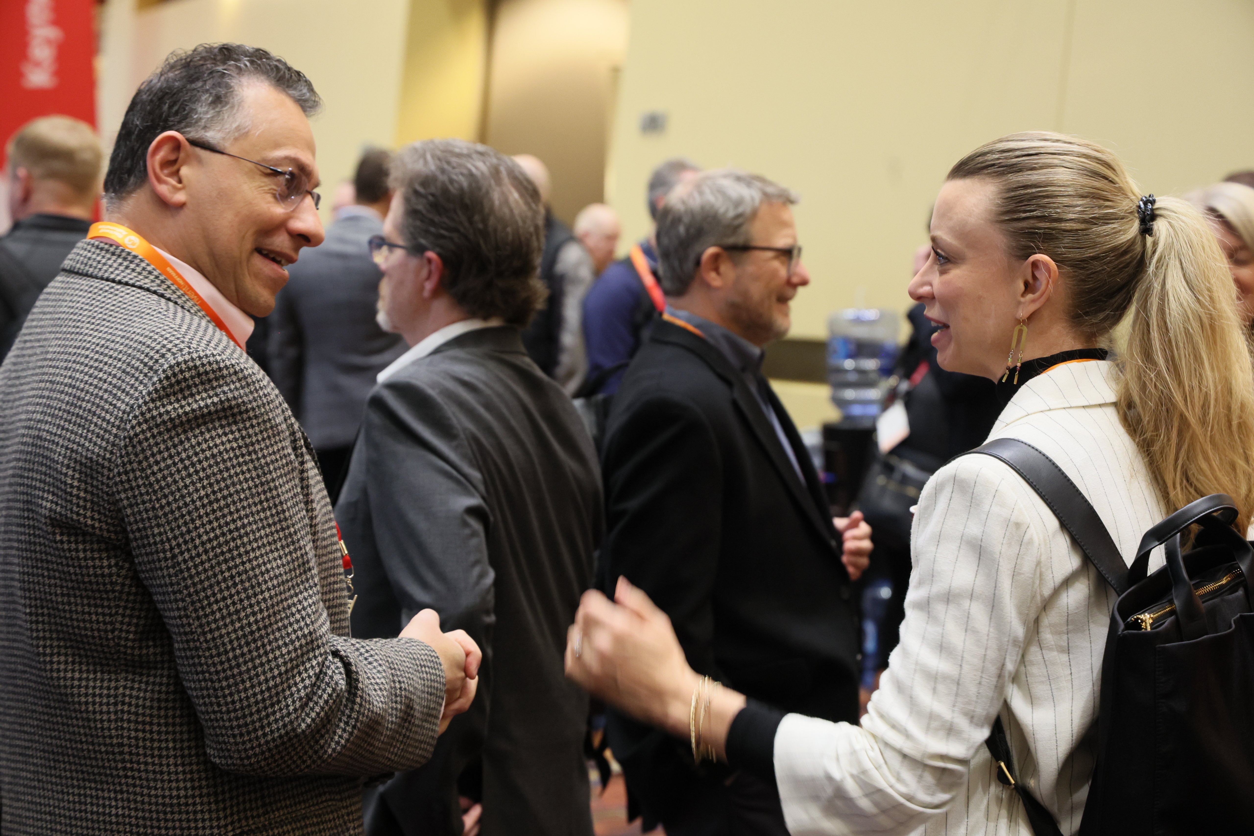 Two people network at Automation Fair