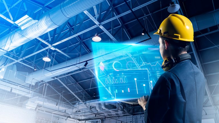 Worker leveraging smart manufacturing applications on the factory floor