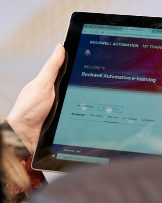 person accessing e-learning on a tablet