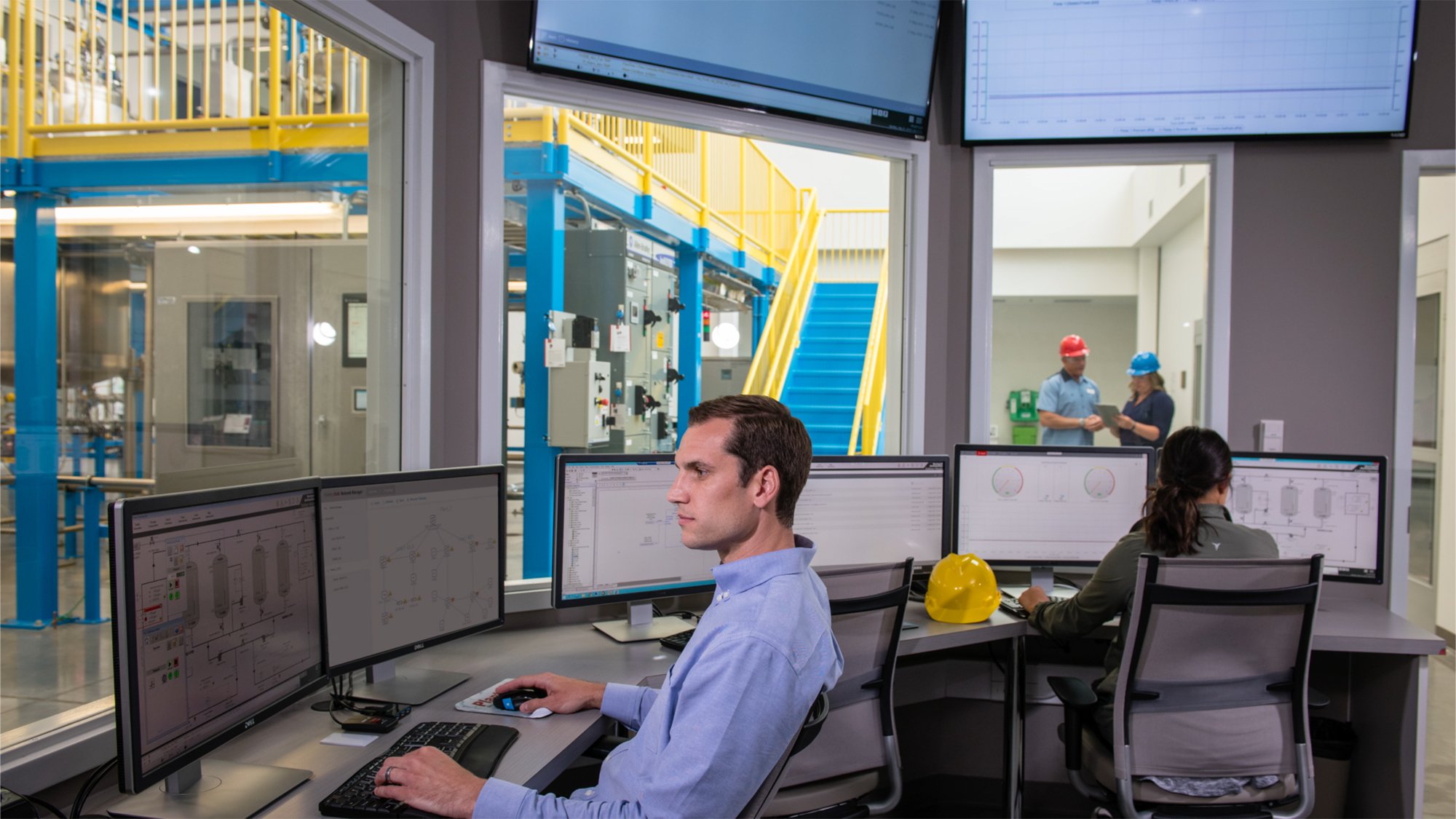 Employee viewing FactoryTalk Network Manager Software on his monitor