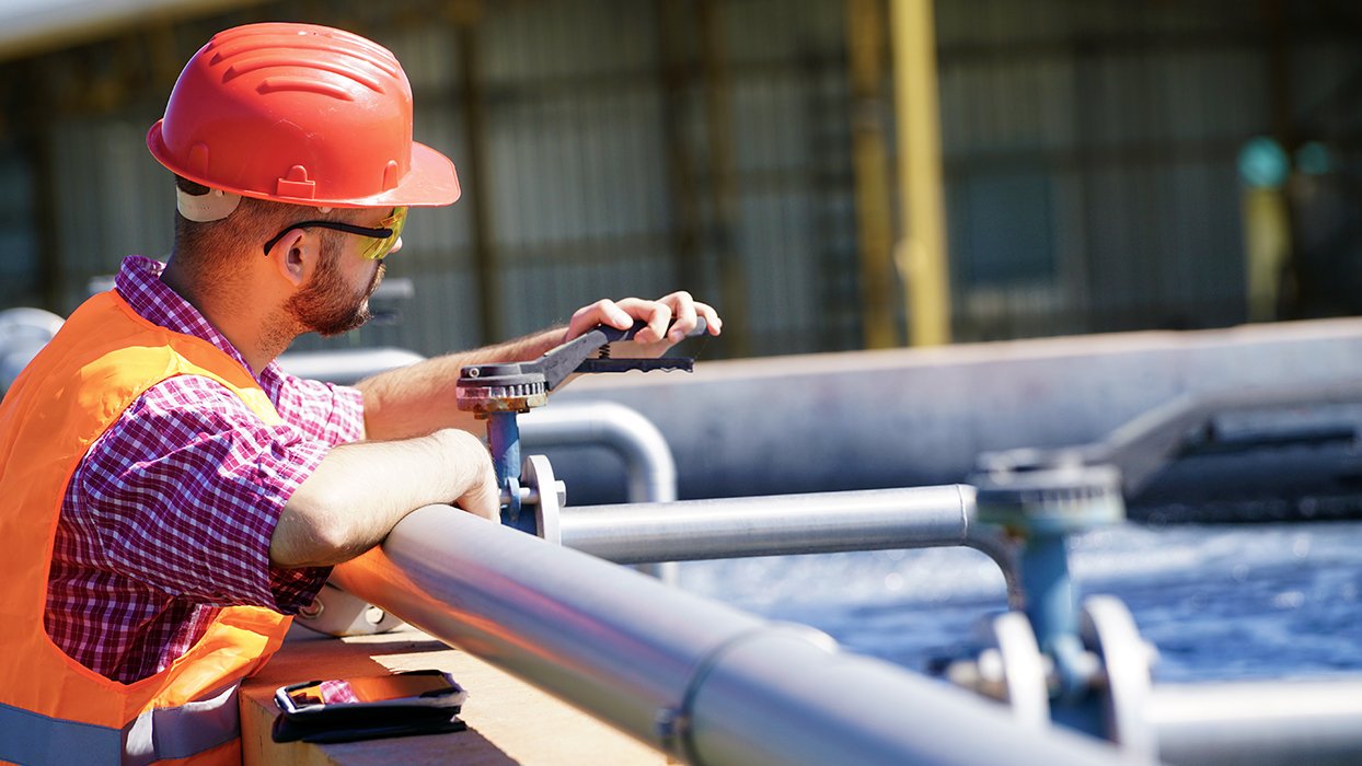 Worker in a wastewater treatment plant