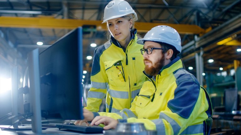 Workers remotely accessing their cybersecurity asset management system to protect their plants. 