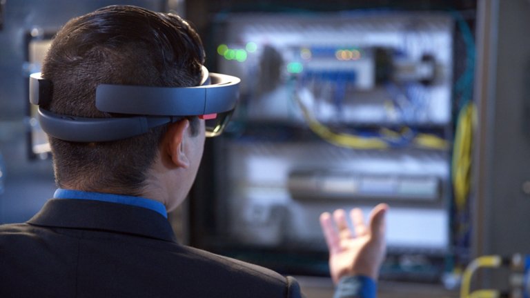 Worker using extended reality uses a mix of wearable and handheld augmented reality (AR), mixed reality (MR) and virtual reality (VR) tools