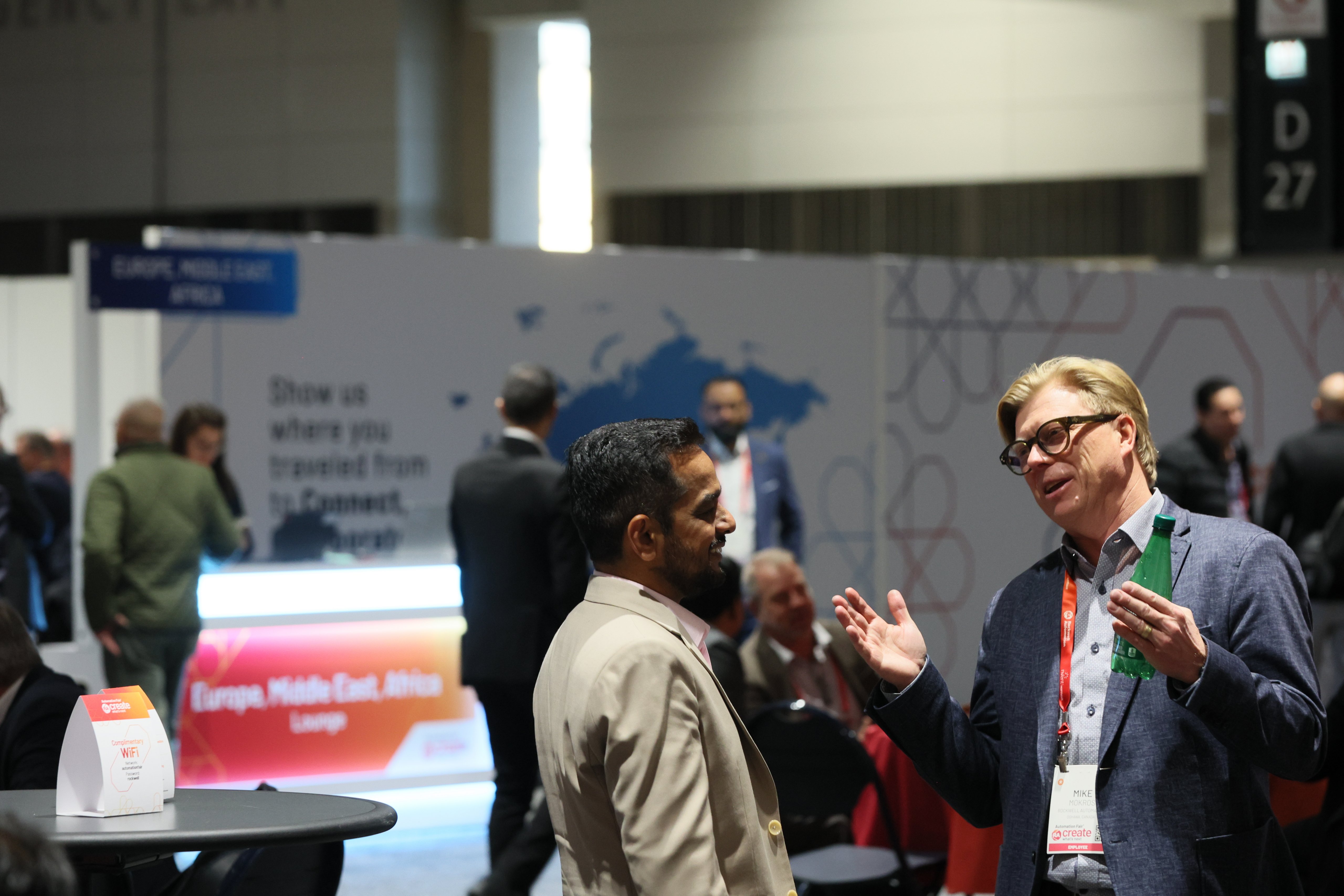 Two men talking at the Automation Fair event