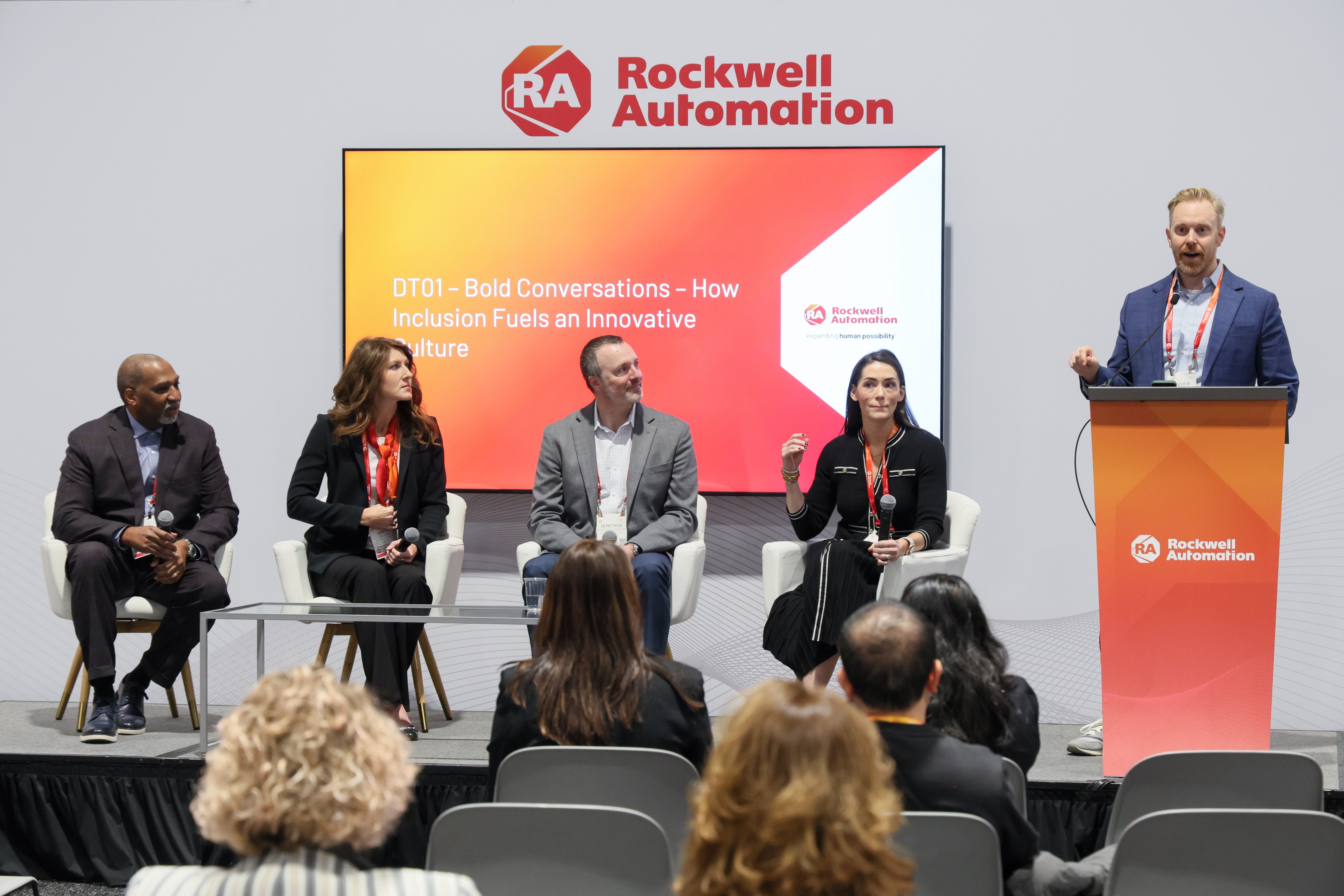 A panel and presenter on stage at the Automation Fair event