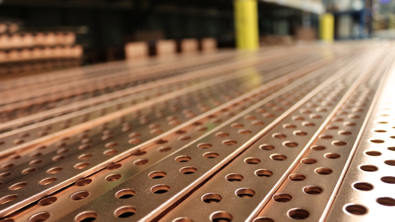 strips of copper closeup with perforated holes