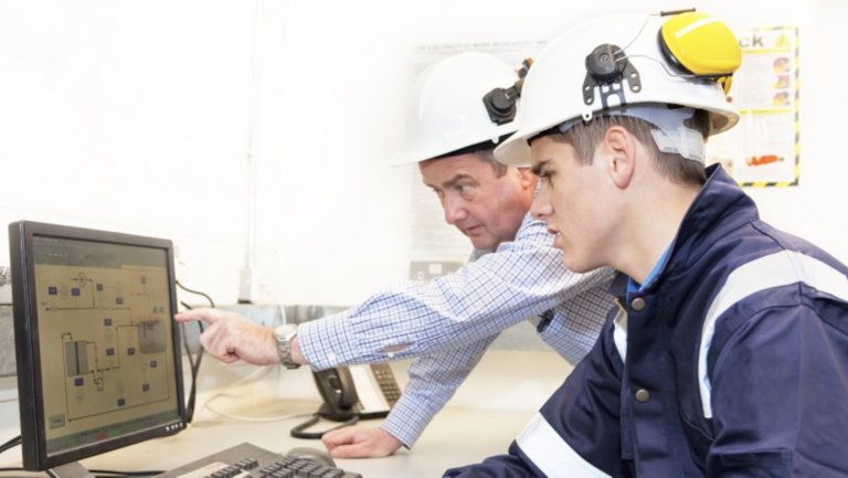  Process Control room and Industrial Automation in industry 4.0 technology trend concept. Engineer and director manager monitoring real time work automation machine process in smart factory