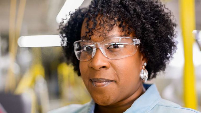 Female employee wearing safey glasses
