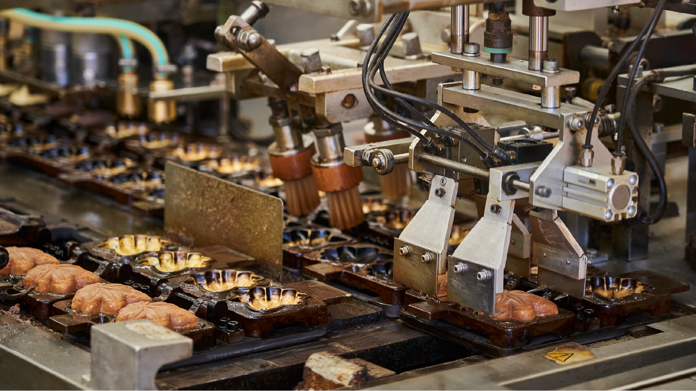 Industrial bakery equipment automating batter dispensing as part of a digital manufacturing process