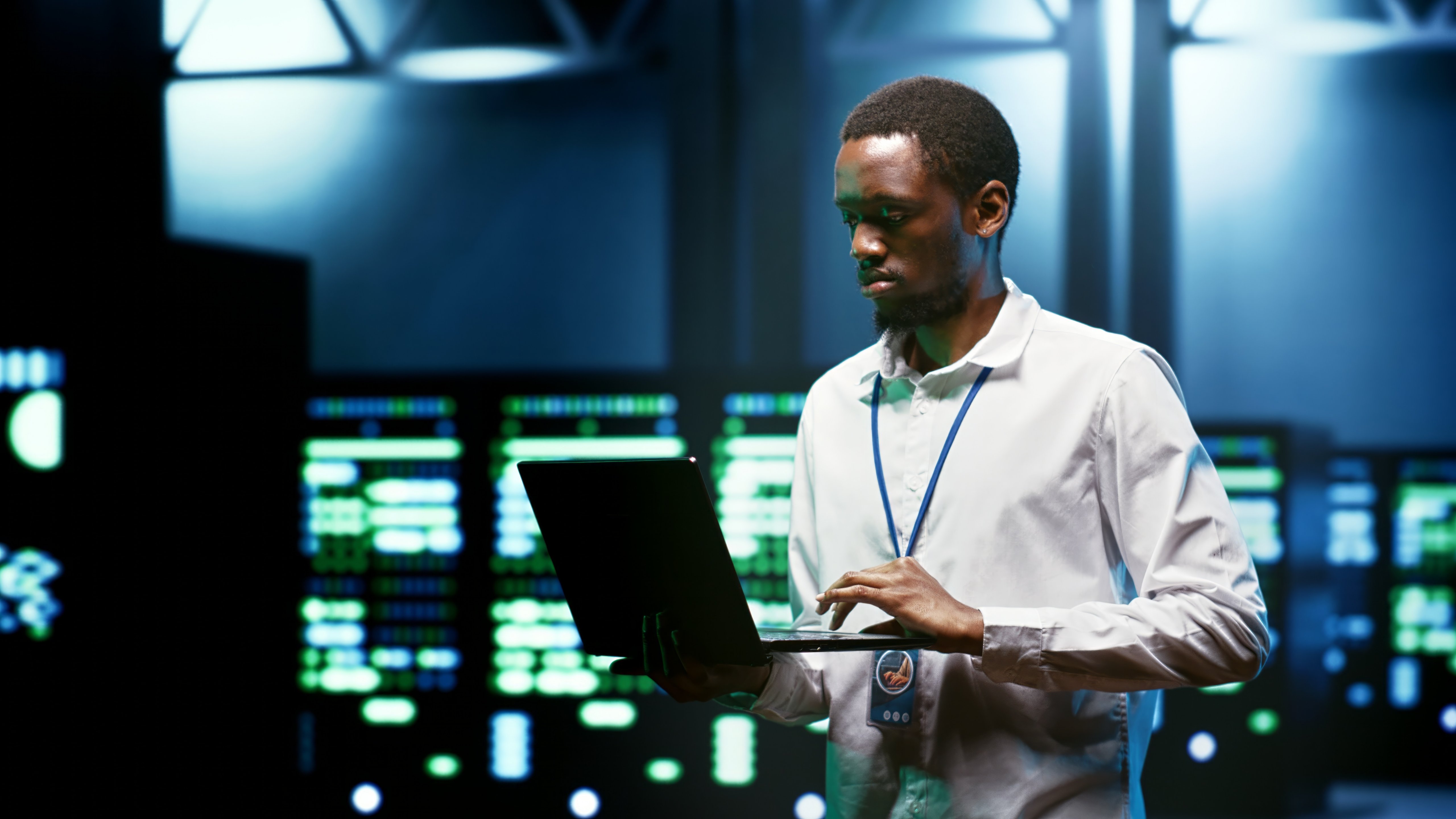 Admin using laptop to set up supercomputer hub infrastructure advanced firewalls and intrusion detection systems. Cybersecurity professional preventing hacking, malware, and phishing attacks
