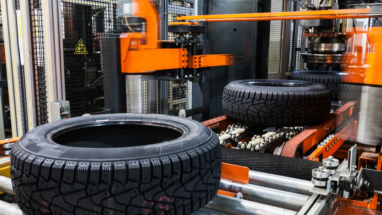 Tires on conveyor line going through quality testing
