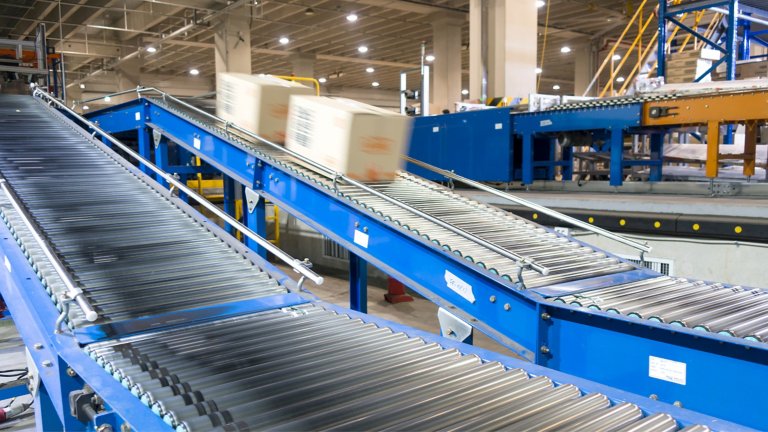 Automated warehouse. Boxes moving on conveyer.