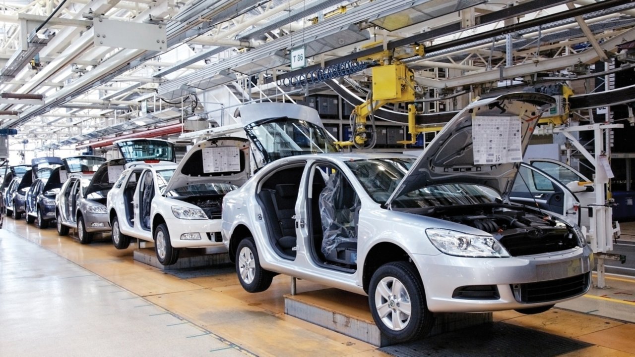 Cars assembly line in automotive factory