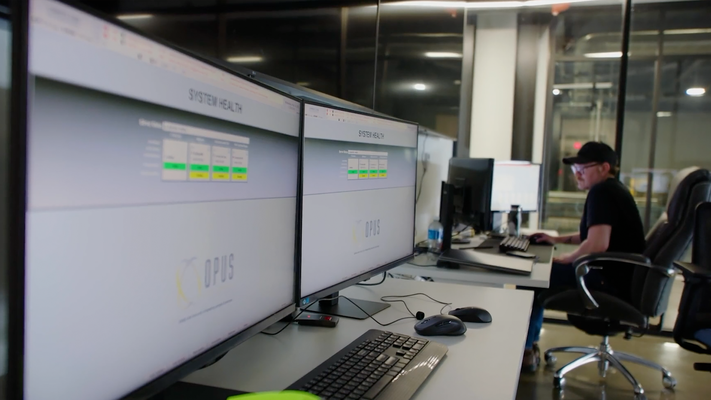 control room man working distillery screens