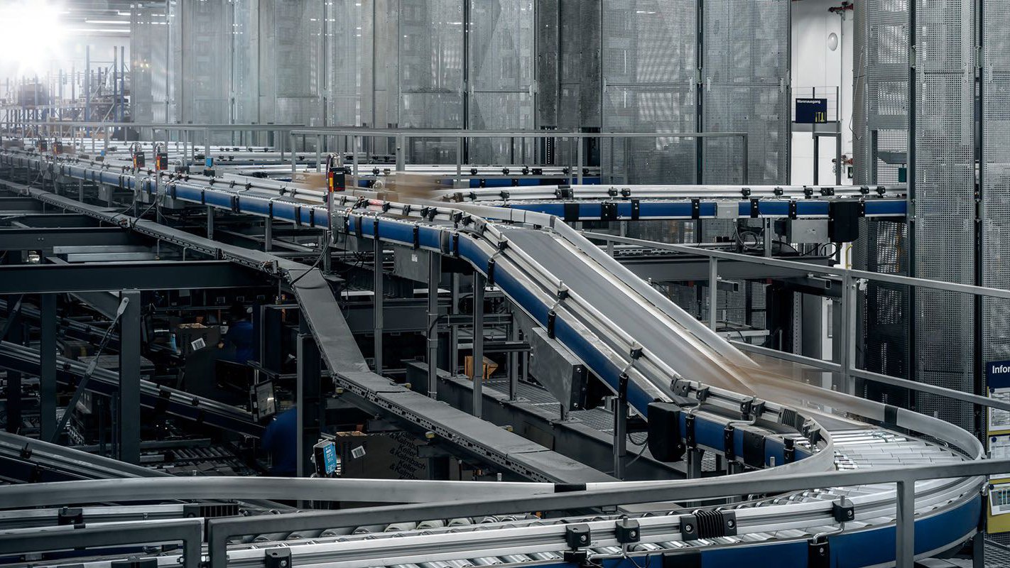 Conveyor belts automatically sort transmit packages.