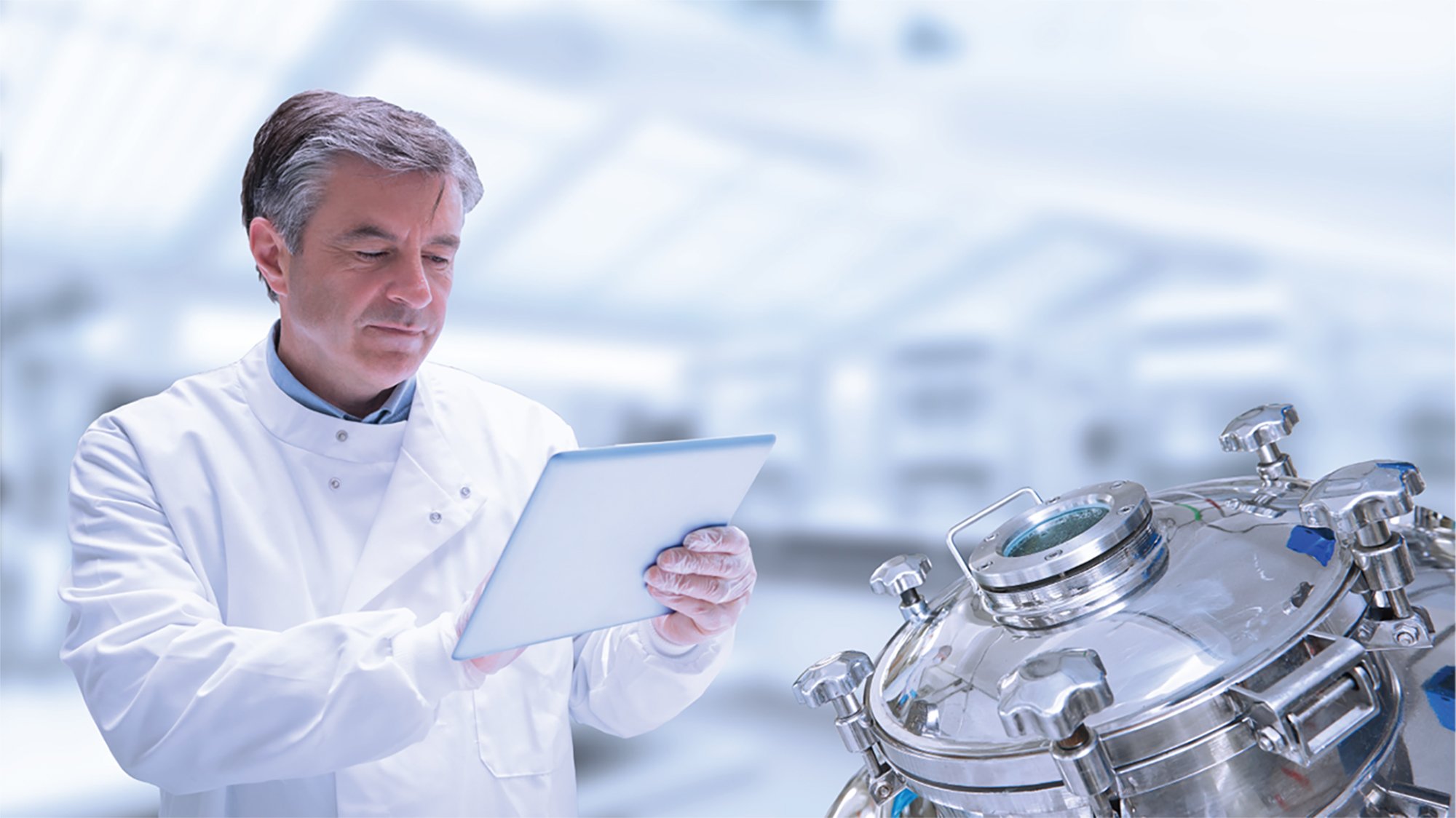 Pharmaceutical lab employee viewing data on a tablet