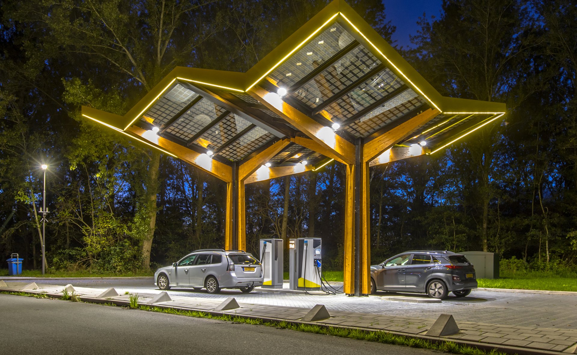 Electric cars charging at electricity filling station in the fast expanding car charging network in the Netherlands