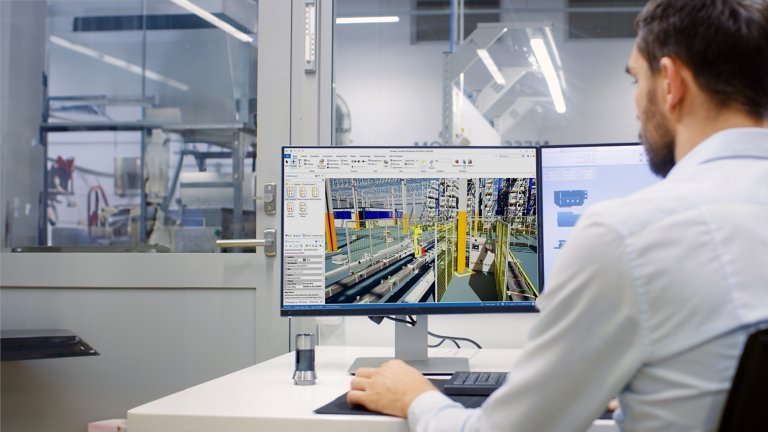 Man looking at screens featuring Emulate3D digital twin software