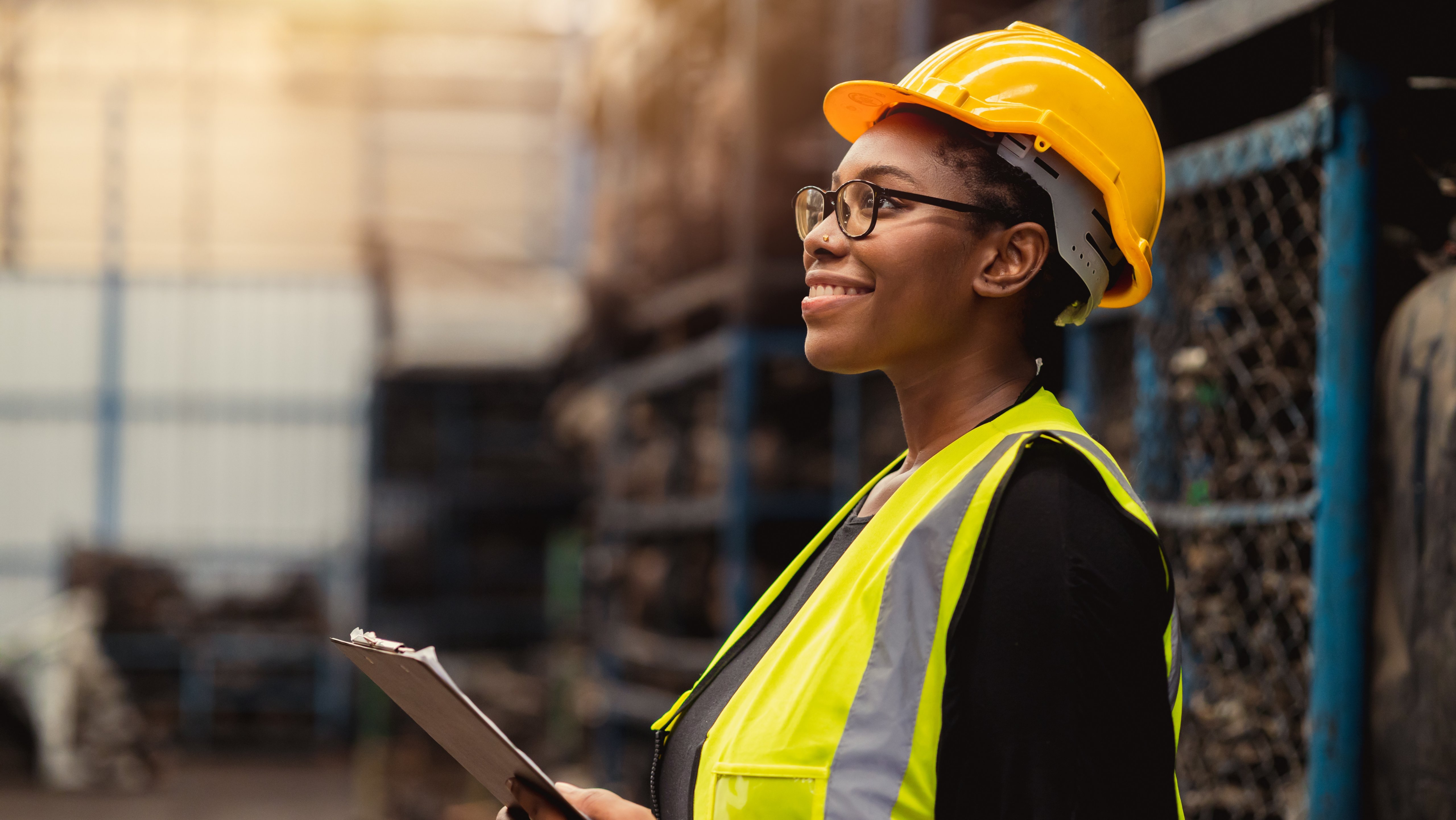 Happy Black African women engineer worker enjoy working in factory industry.