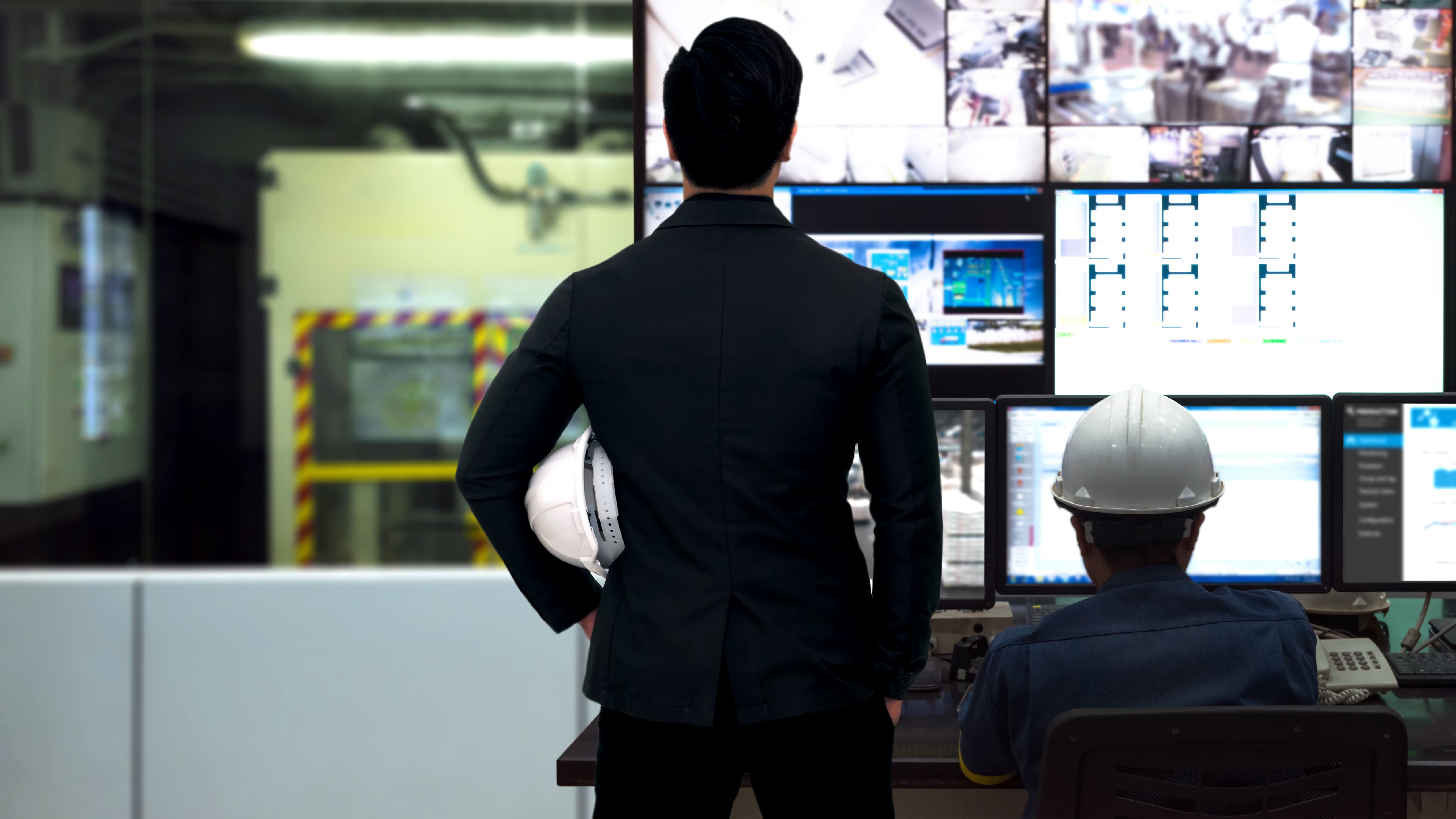 Engineer and Manager in Process Control Room