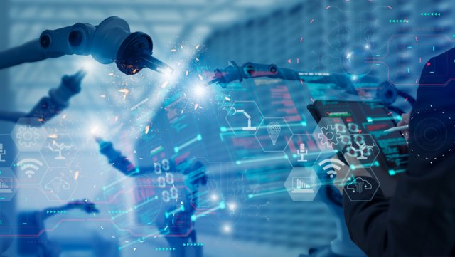 Industry engineer in factory,using visual smart tablet device,control automated robot arm machine learning operation,concept business and industry 4.0,Artificial intelligence or AI,with 5G network