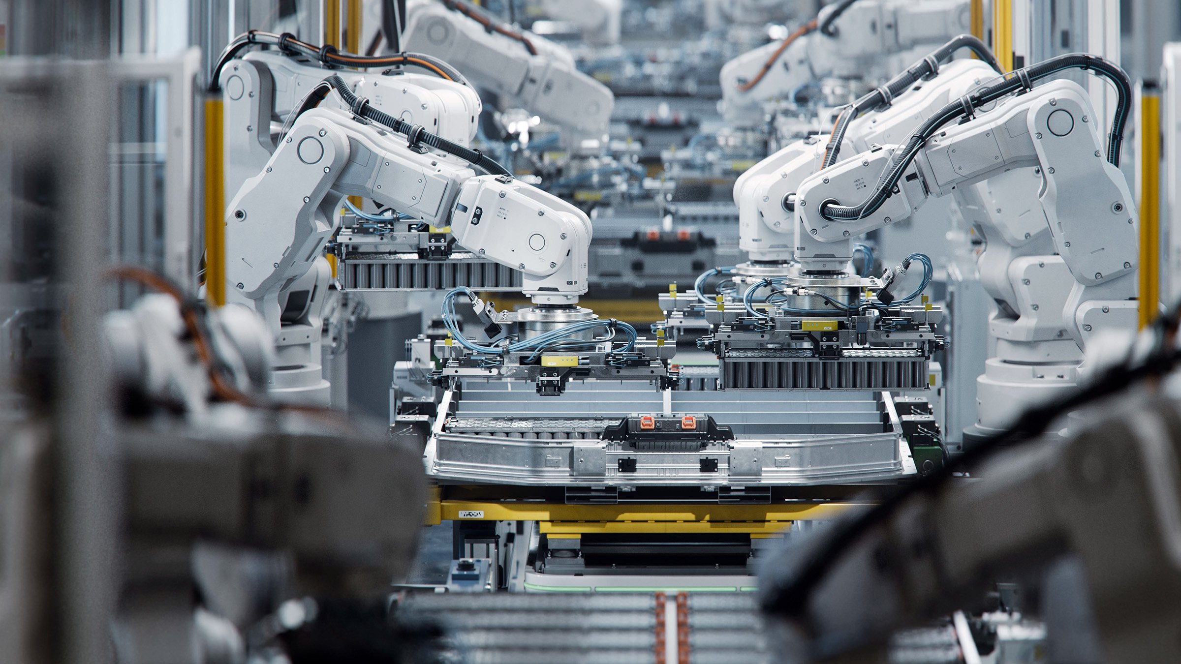 Lithium-Ion EV Battery Pack Production at Large Automated Assembly Line at Bright Factory Equipped With Industrial Robot Arms. Electric Car Manufacturing. Row of White Robotic Arms at Factory