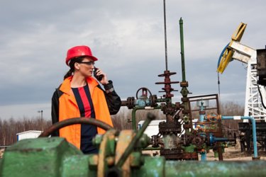 female engineer on walkie talkie in work field