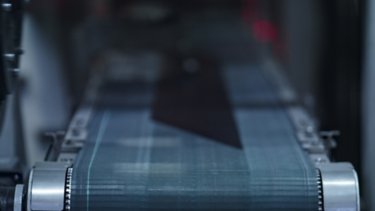 Closeup tire conveyor belt at modern industrial manufacture working process. Automated robotic technology of tyre production automation in automotive warehouse. Auto machinery industry concept
