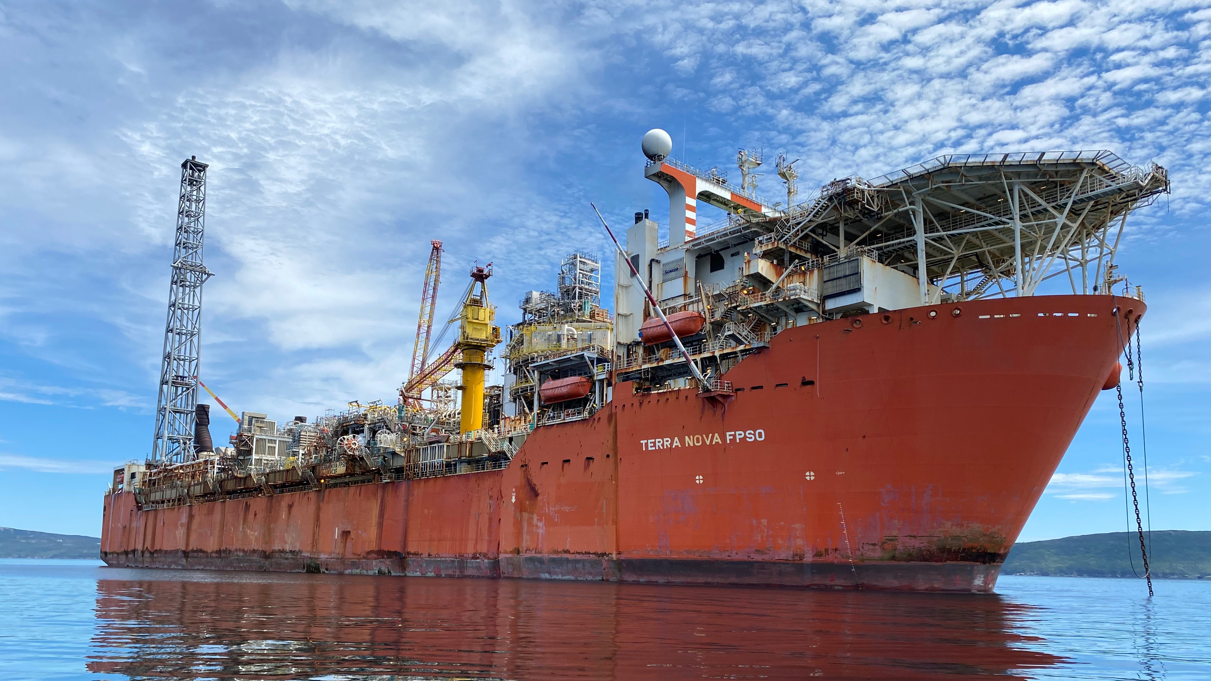 Conception Bay, Newfoundland - July 23 2020: Terra Nova FPSO anchored in Conception Bay on glassy calm water.