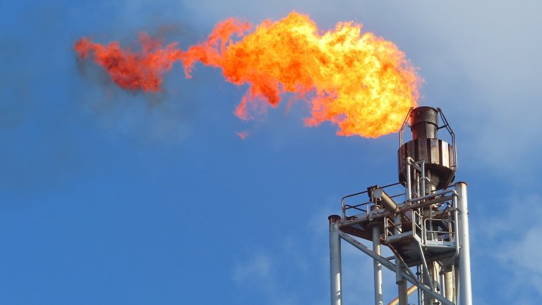 Gas or flare burn on offshore platform. Offshore construction platform for production oil and gas industry