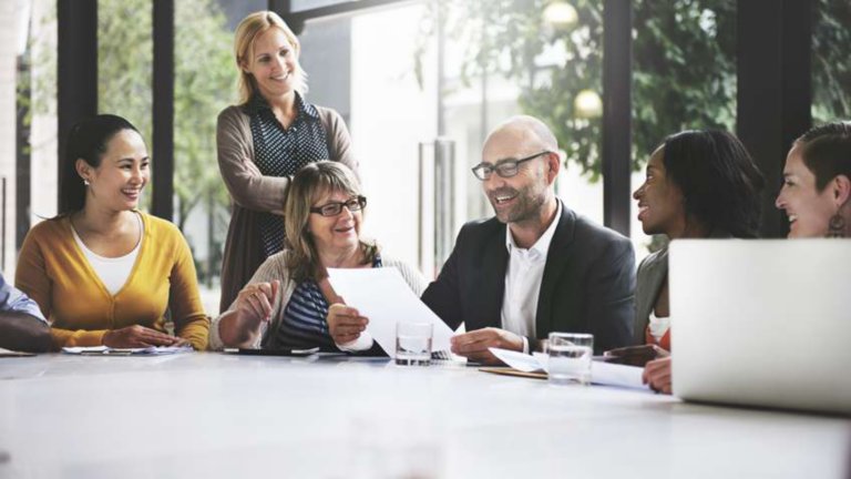 Several people sitting around a table