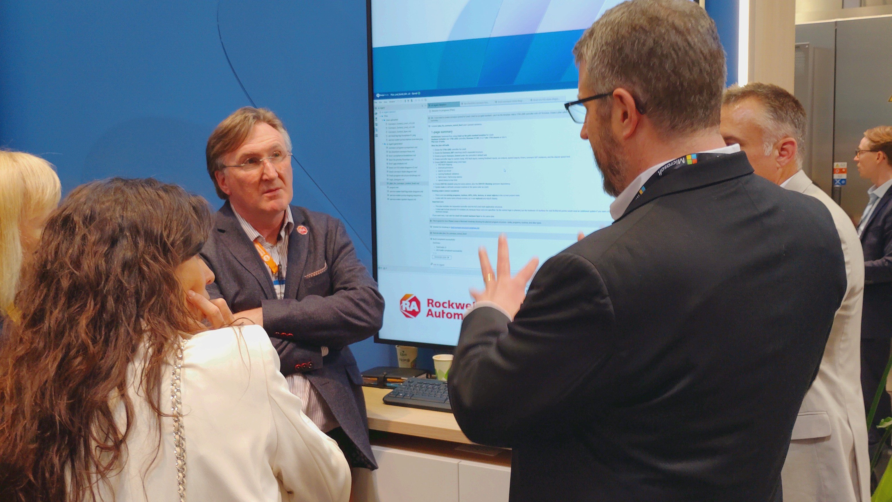 Group discussing information on screen
