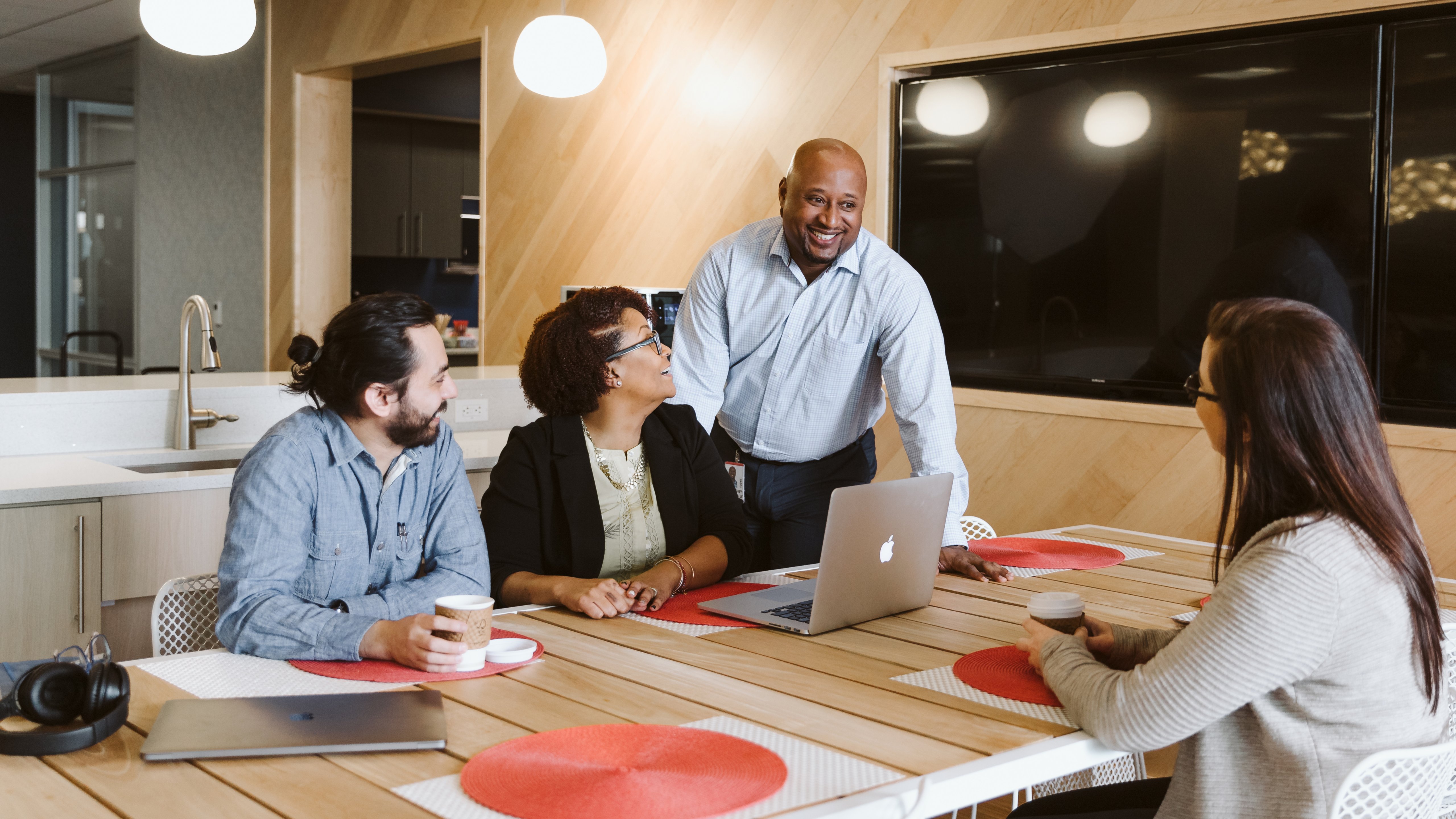 Group of employees having a discussion in the office meeting room