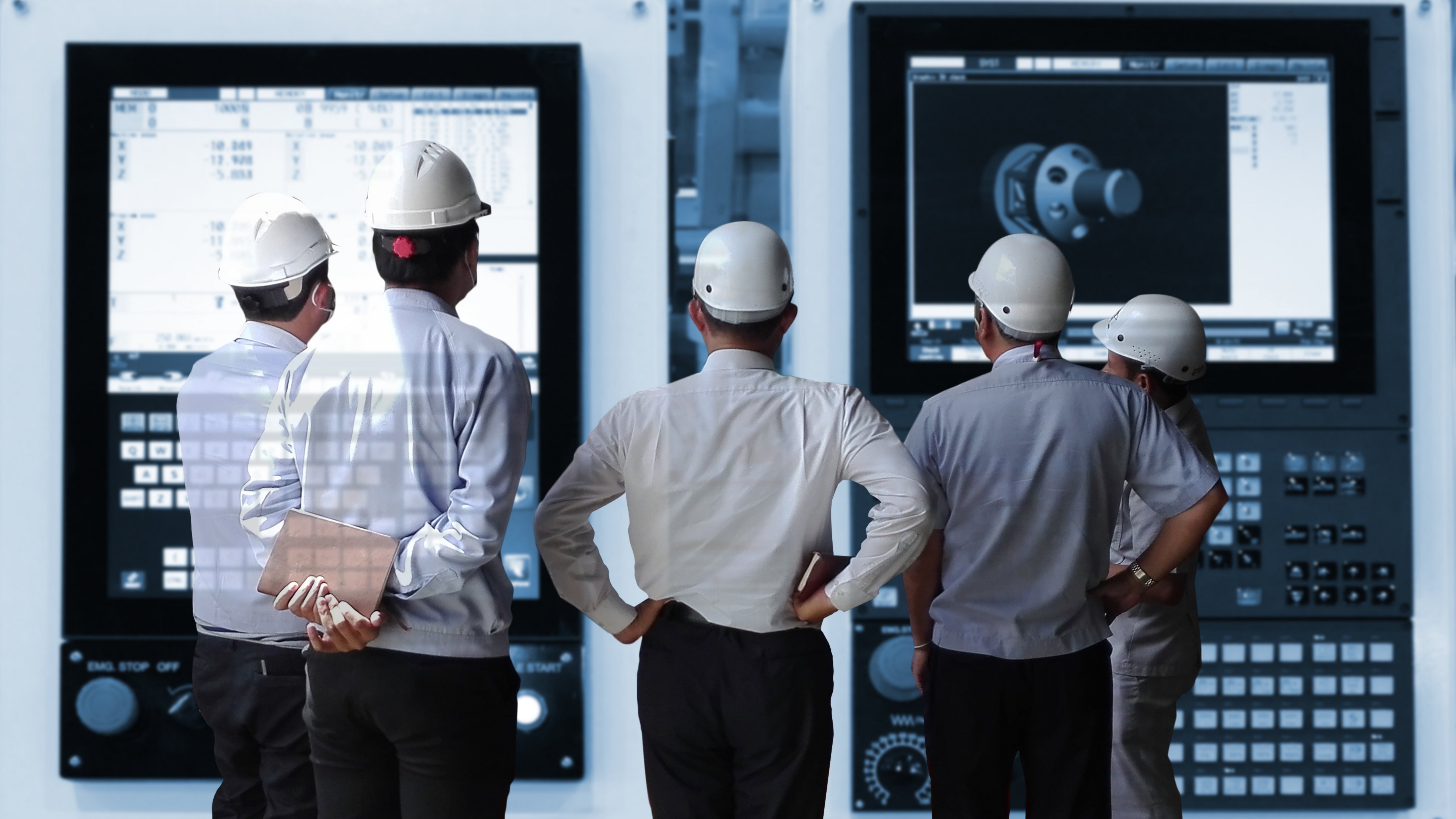 Gourp of engineers standing in front of monitors