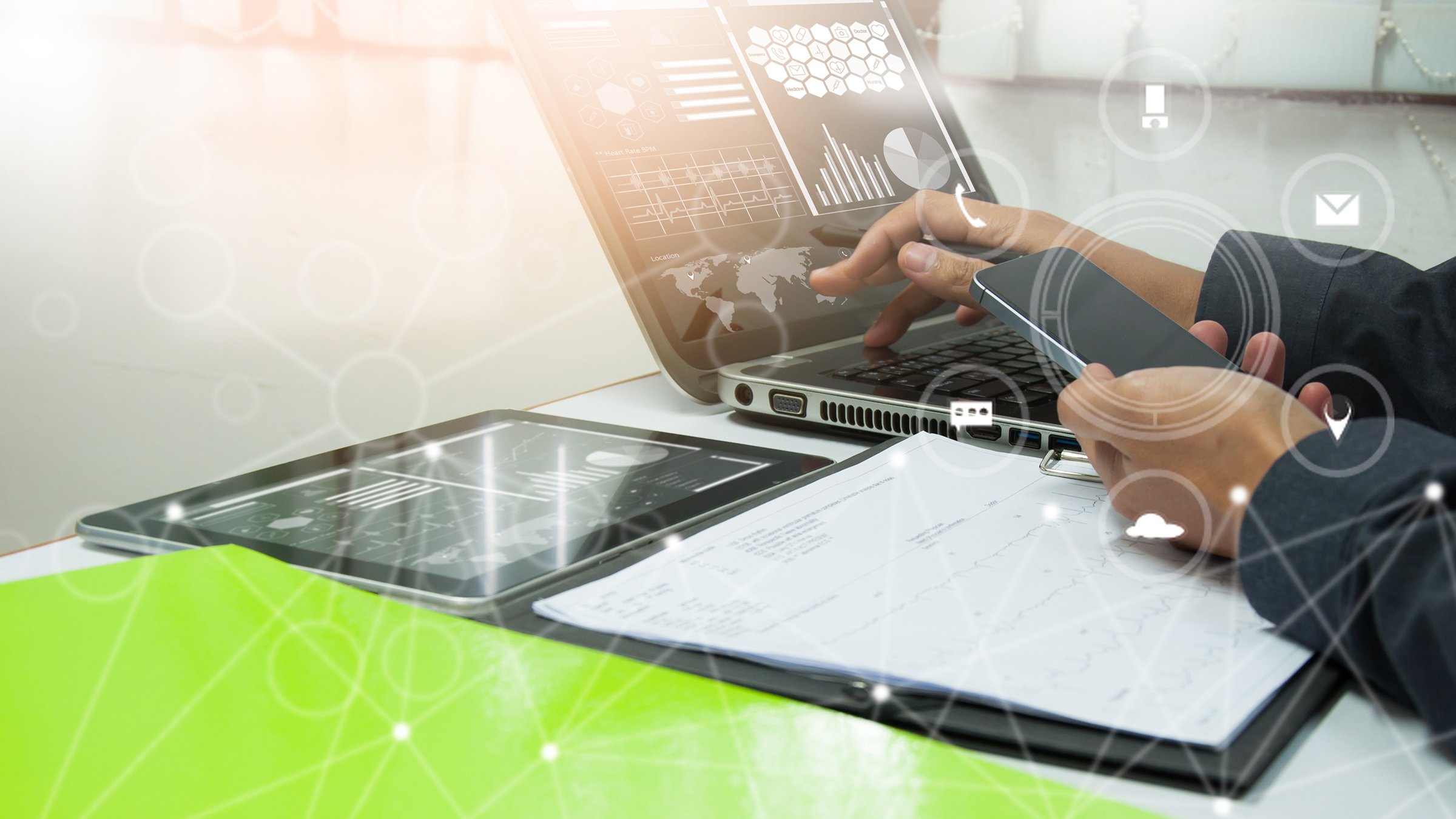 businessman working with business documents on office table with digital tablet computer and graph finance diagram in the background