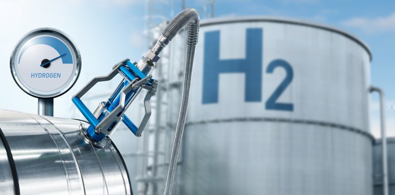 Hydrogen gauge and nozzle on a background of gas tanks
