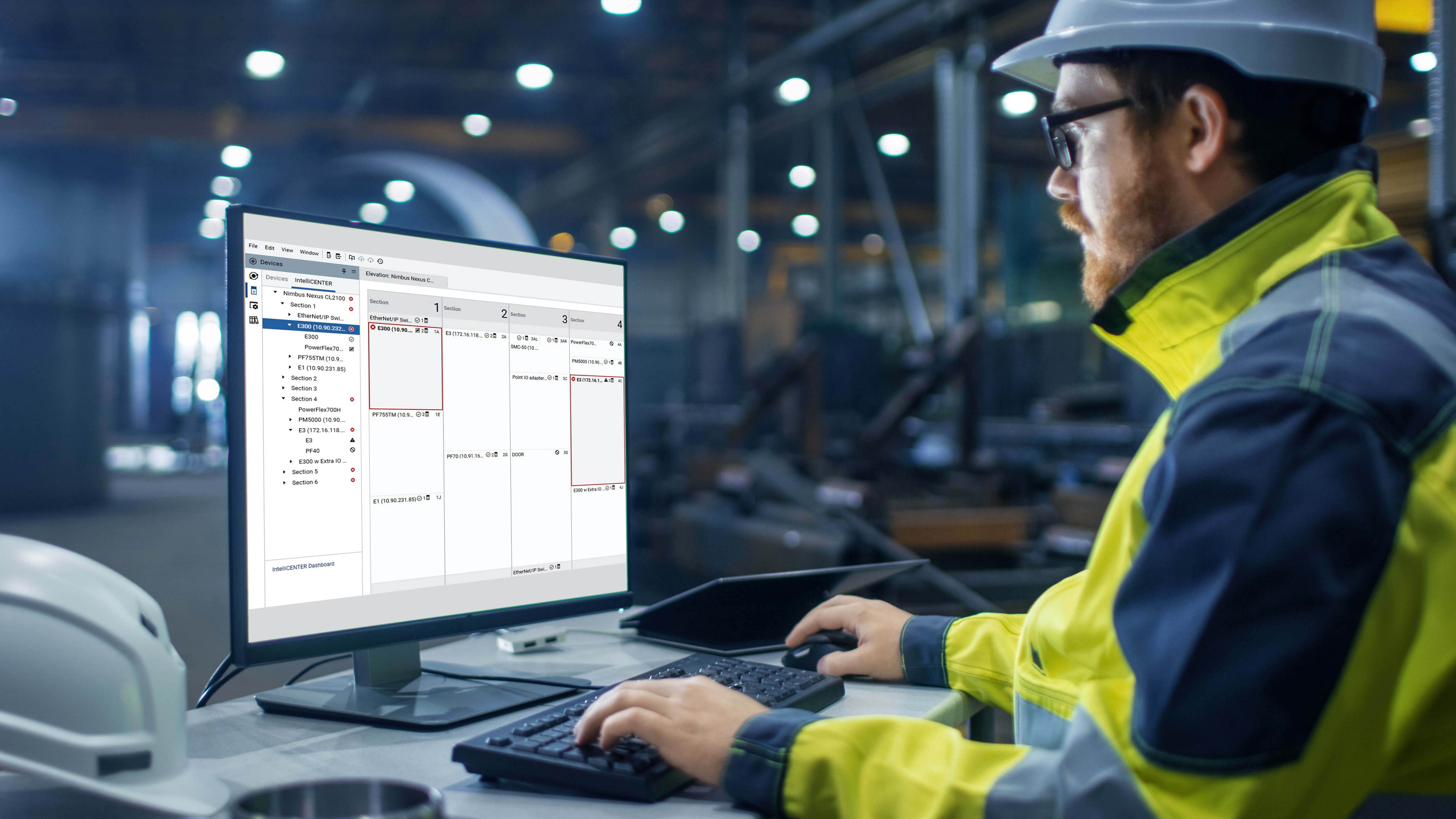Industrial engineer working on computer in factory