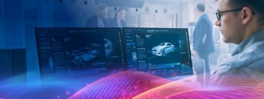 Man looking at two monitors with car drawings. Colorful graphics and two other people in the background. From SOSM INFO-BR028B-EN-P