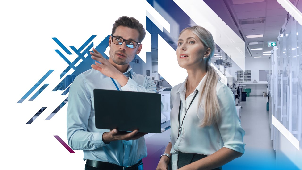 Man holding laptop and pointing up with woman looking up with pharma background
