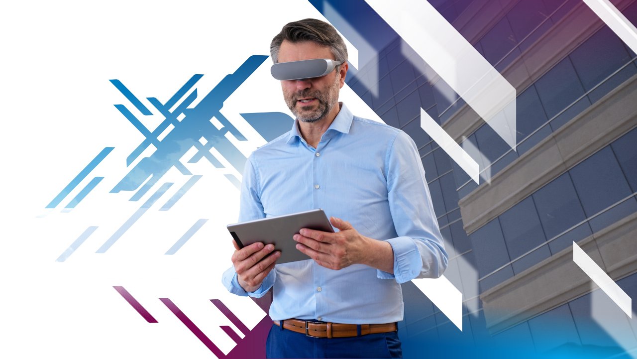 Man with VR goggles holding iPad