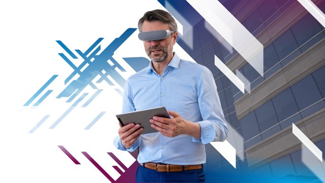 Man with VR goggles holding iPad