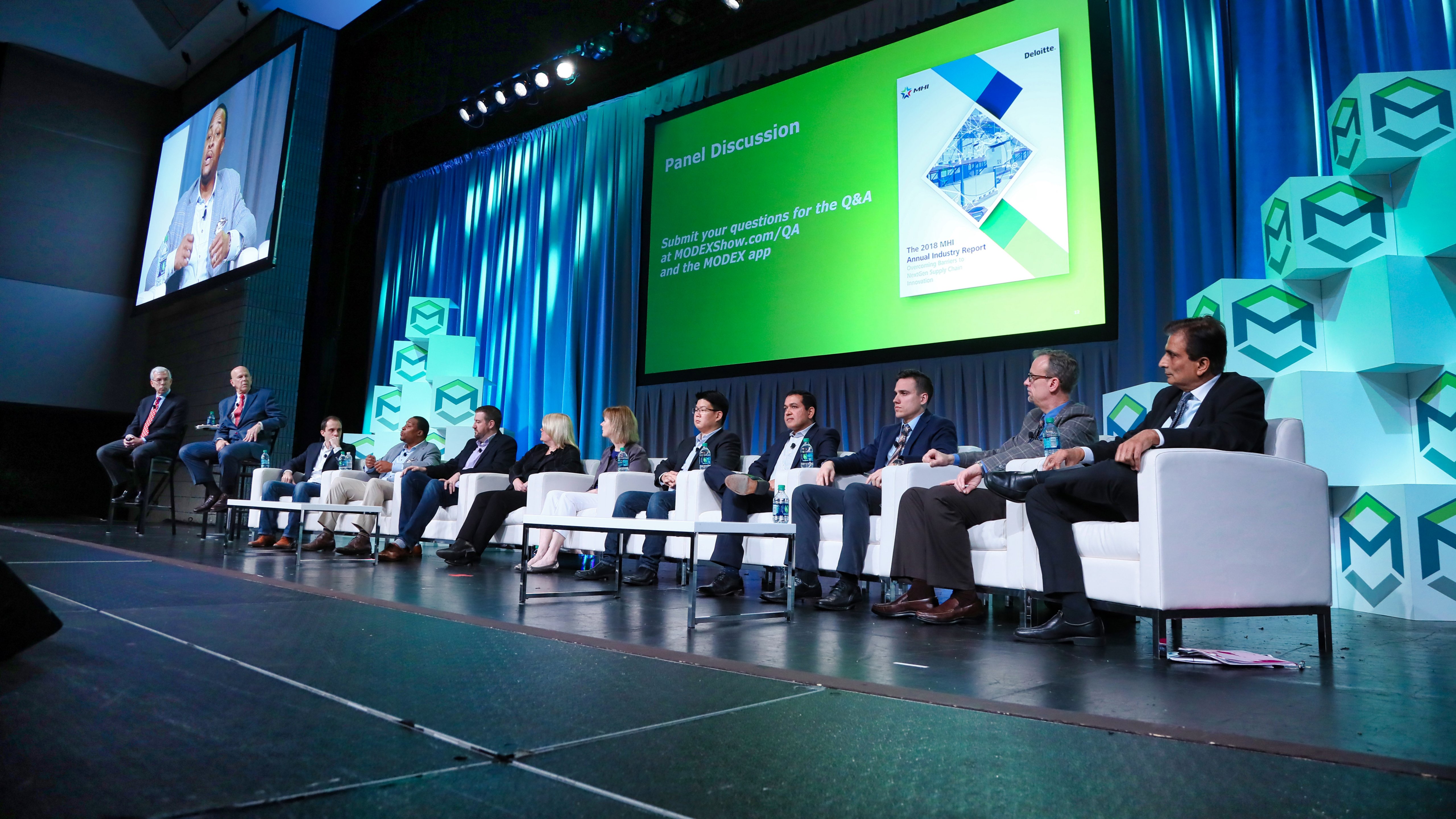 Speakers sitting onstage during a keynote session at MODEX 2024.