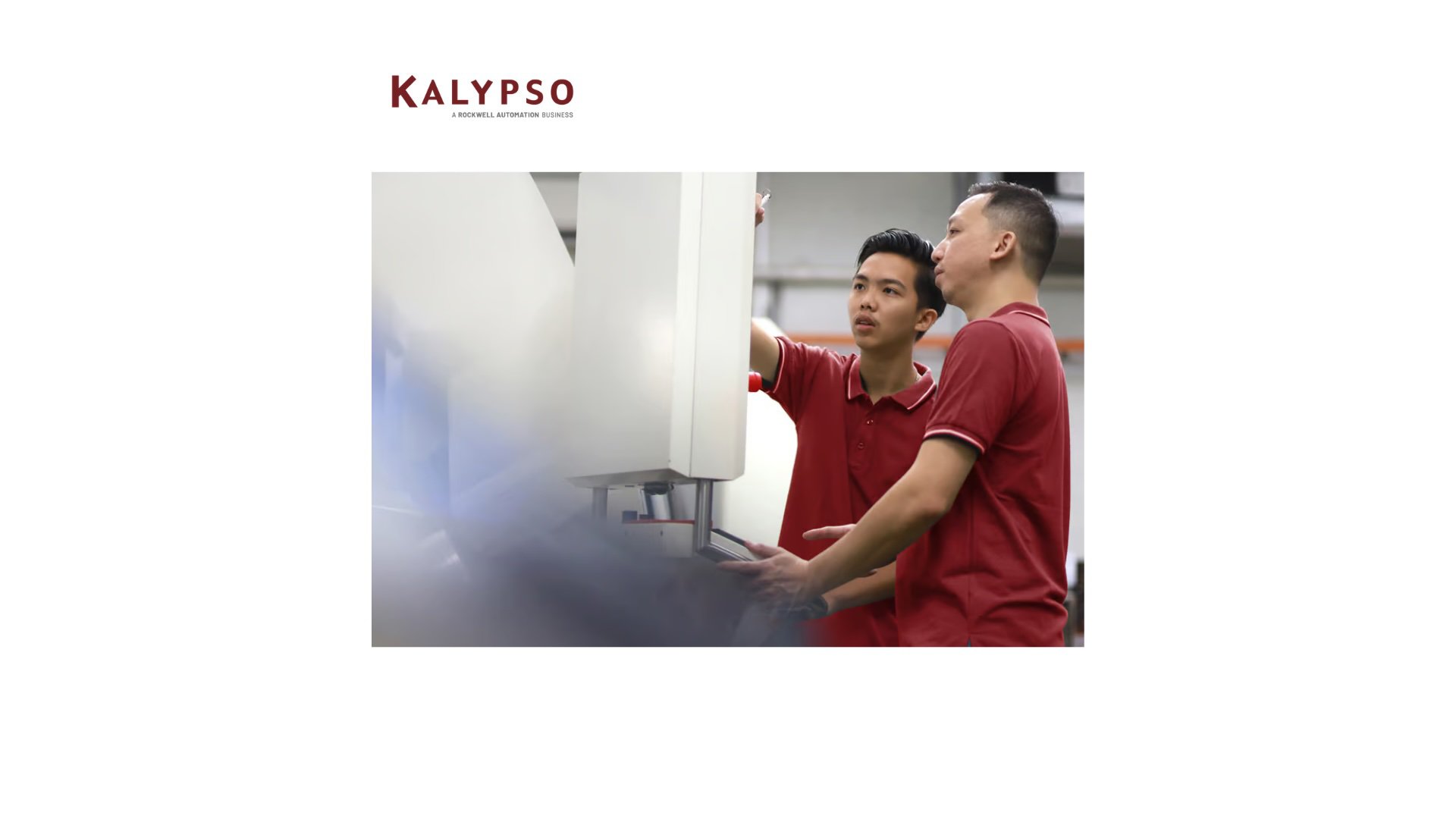 two employees in red shirts working on Kalypso