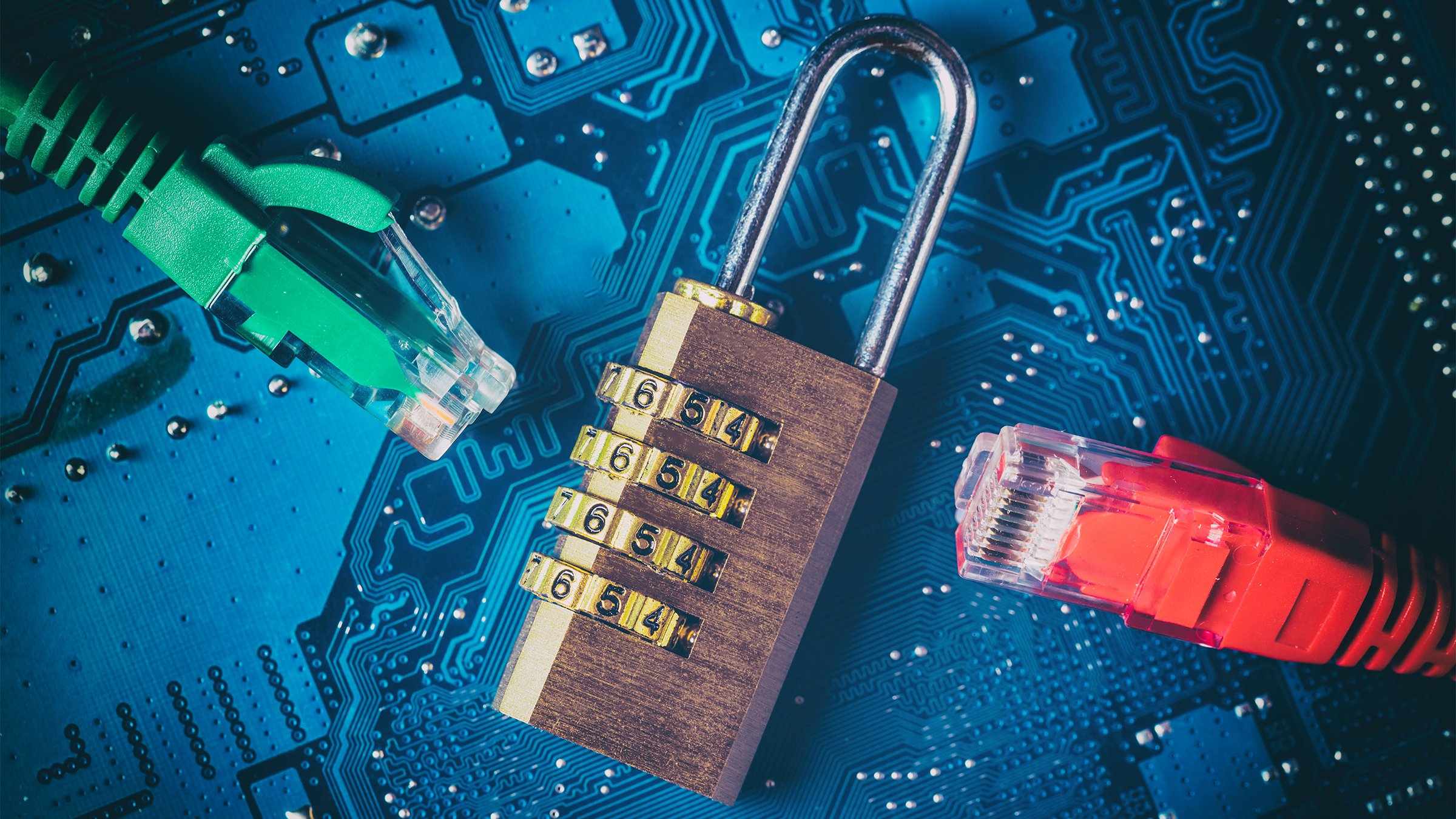 Network ethernet cables near opened padlock on blue computer motherboard, representing Internet data privacy and information cybersecurity.