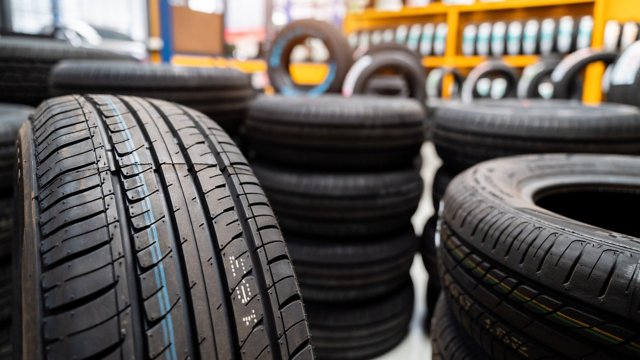 New tires, Car tires at warehouse. Car tires, Automobile industry.