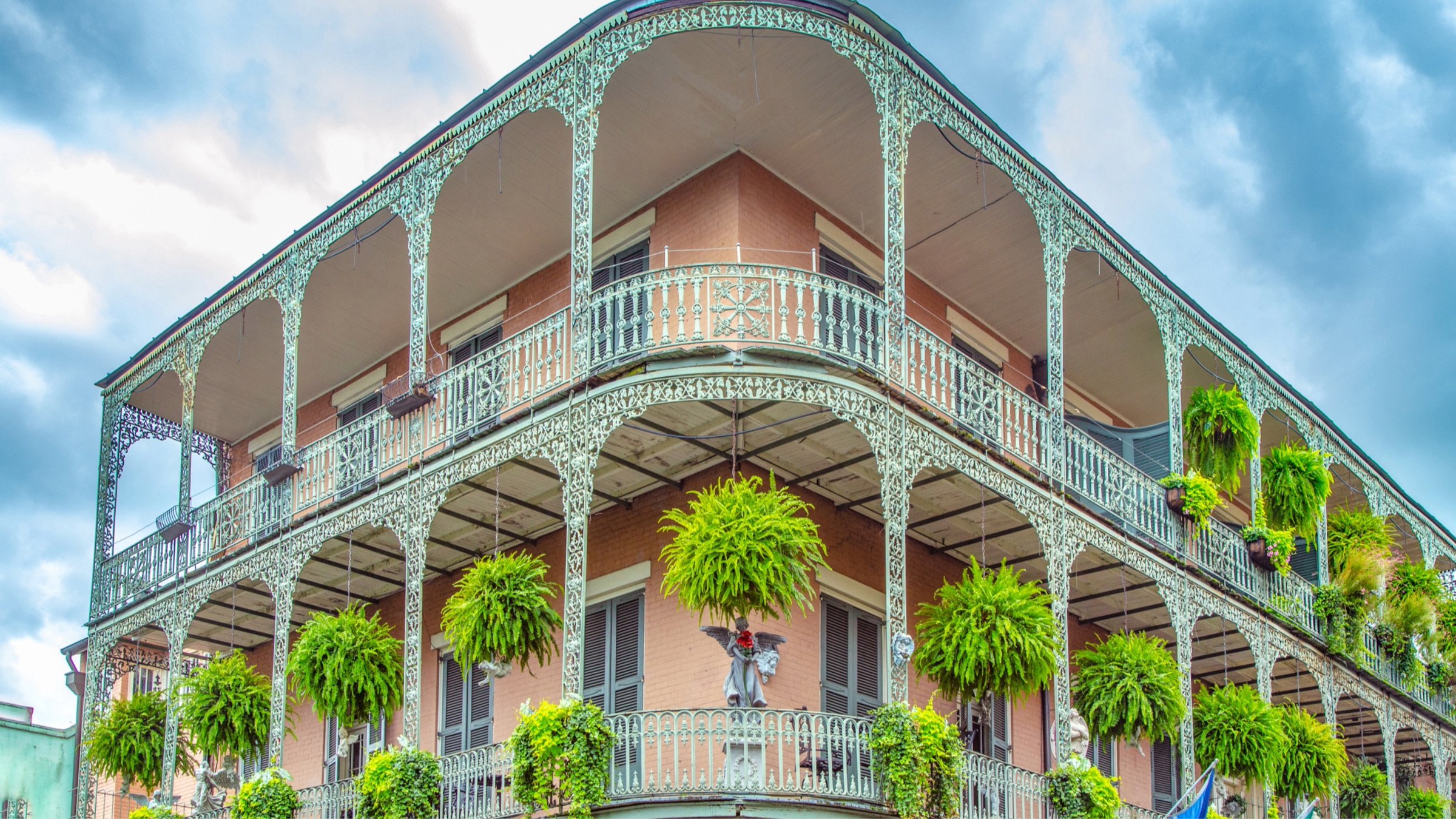 New Orleans style architecture with balcony and flowers.
