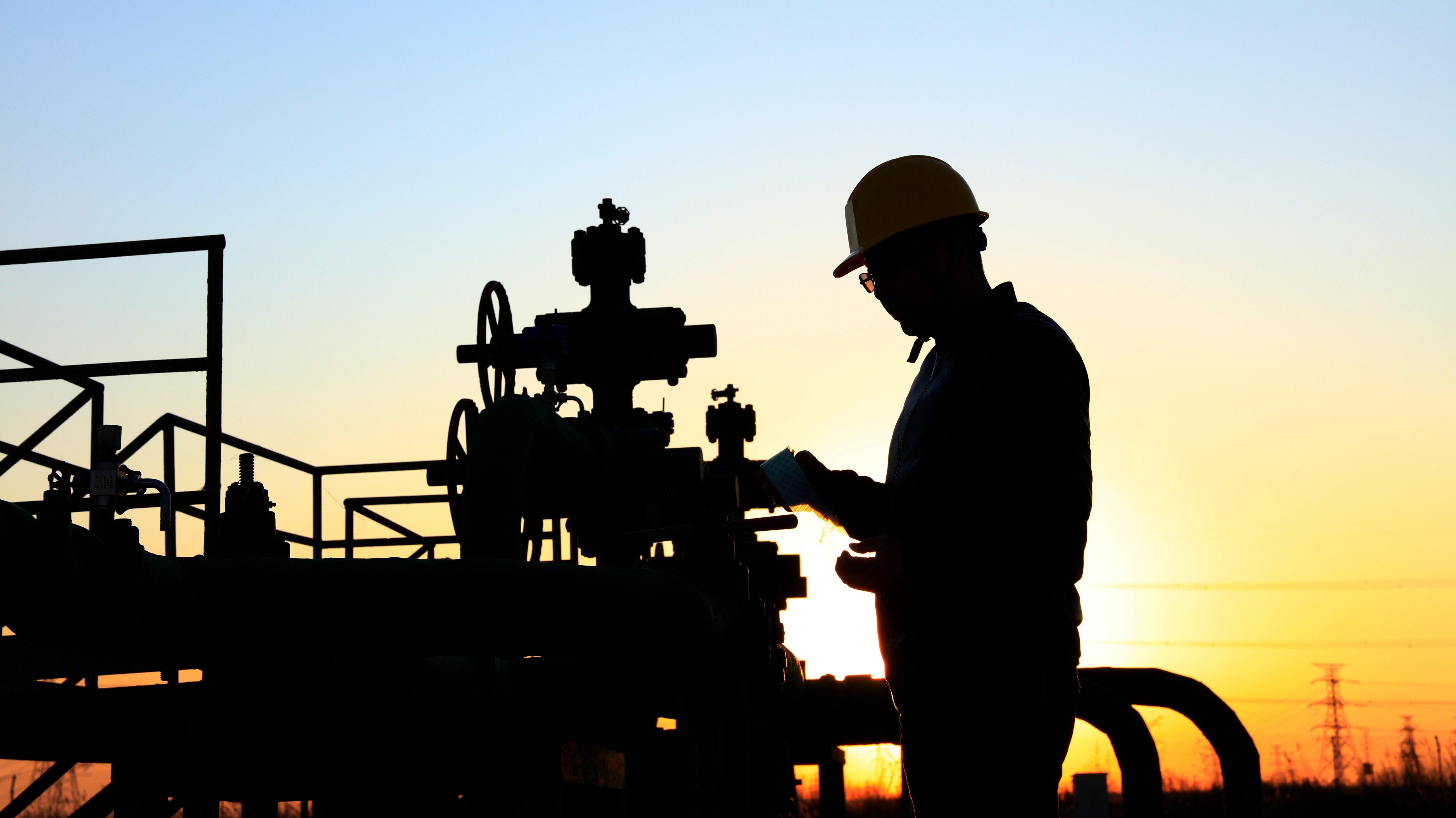 In the evening，oil field, the oil workers are working