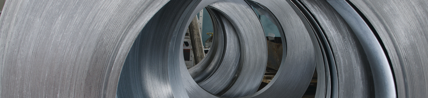 large metal coils in a manufacturing facility
